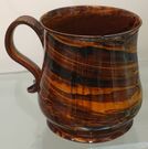 Photo by Daderot on commons.wikimedia.org/  File:Mug, attributed to Samuel Bell's Lower Street Potworks, Staffordshire, c. 1740, agateware, HD 2016.10.2 - Flynt Center of Early New England Life - Deerfield, Massachusetts - DSC04445.jpg